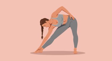 Gri atletik elbiseli bir kadın üçgen yoga pozu veriyor, ayak parmaklarına dokunmak için eğiyor, saçlarını düzgün örüyor..
