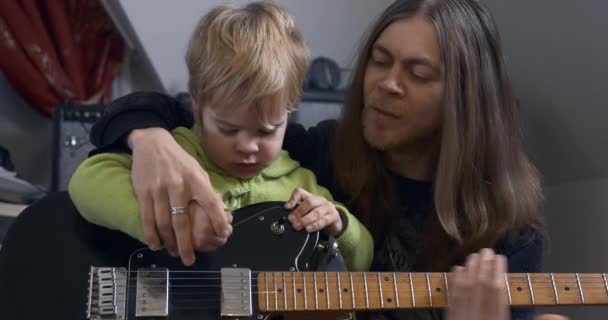 Young Rocker Musician Man Teaches Child Playing Electric Guitar Father — Stock Video