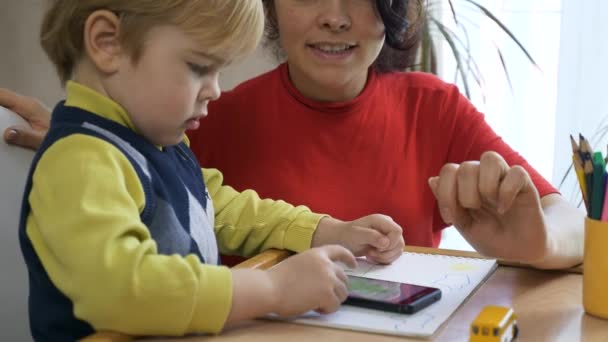 Boy Learns Drawing Smartphone Touch Screen Mother Teaches Son Child — Stock Video