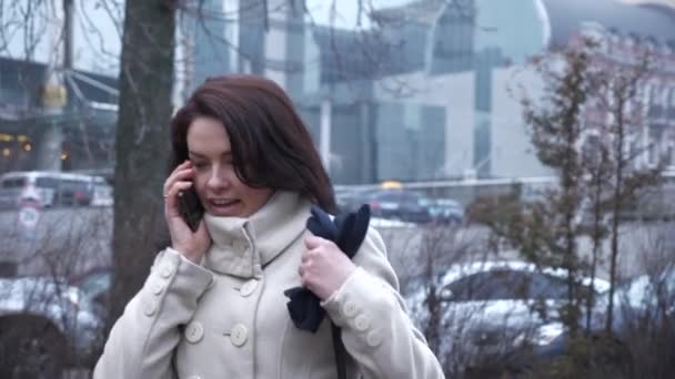 Worried Young Mother Talking Smartphone While Walking Little Child City — Stock Video