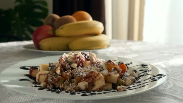 Close Dessert Covered Coconut Flakes Chocolate Raw Fruit Salad Bananas — Stock Video