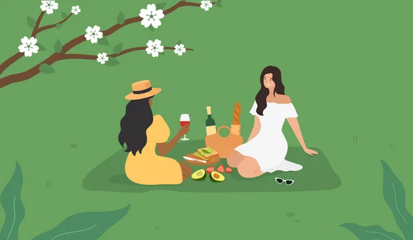 Picnic de Primavera Verano. Hermosas chicas sentadas en una hierba verde. Tostadas de aguacate, baguette, vino. Vector — Vector de stock