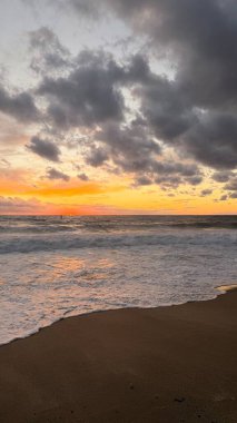 Beach sunset waves. stunning bright colorful sky, seascape. High quality 4k footage
