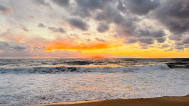 Beach sunset waves. stunning bright colorful sky, seascape. High quality 4k footage