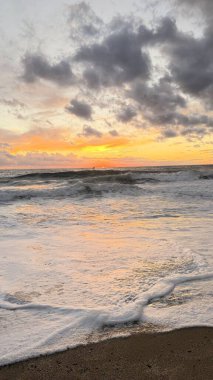 Beach sunset waves. stunning bright colorful sky, seascape. High quality 4k footage