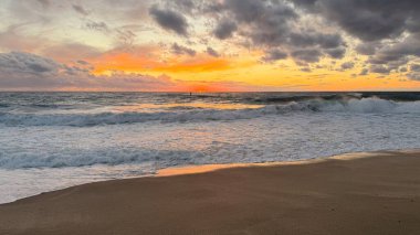 Beach sunset waves. stunning bright colorful sky, seascape. High quality 4k footage