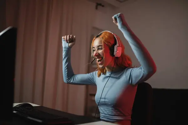 Delighted Female Gamer Headphones Celebrating Win Videogame Fists While Sitting — Stock Photo, Image