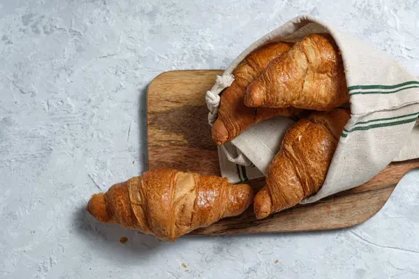 Freshly Baked Croissants Served Wooden Cutting Board Napkin Table Breakfast — Stock Photo, Image