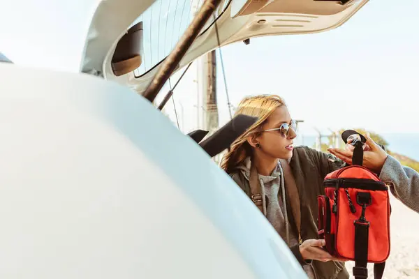 Women Coats Putting Bags Trunk Car Preparing Road Trip Together — Stock Photo, Image