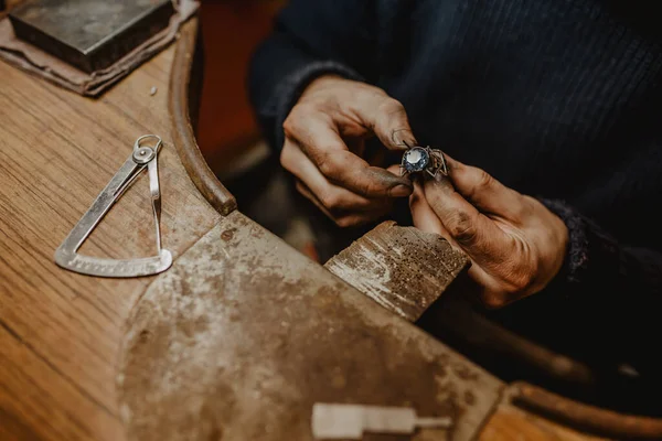 Anonymous Jeweler Holding Unfinished Ring Dirty Hands Checking Quality Workshop — Stock Photo, Image