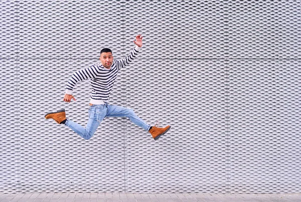 Full Body Excited Hispanic Male Smiling Leaping Pavement Ornamental Gray — Stock Photo, Image