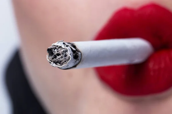 Red lips smoking a cigarette close up — Stock Photo, Image