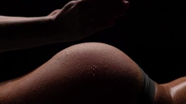 Super slow motion. Womens beautiful ass, hand slaps the ass.