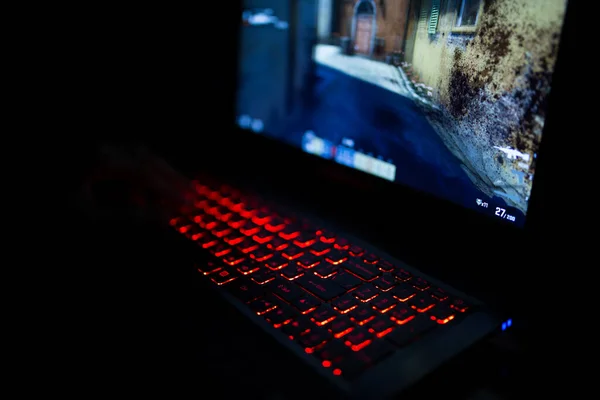 Kiev, Ukraine - June 12, 2019: Red backlit keyboard close up. Gaming laptop. — Stock Photo, Image
