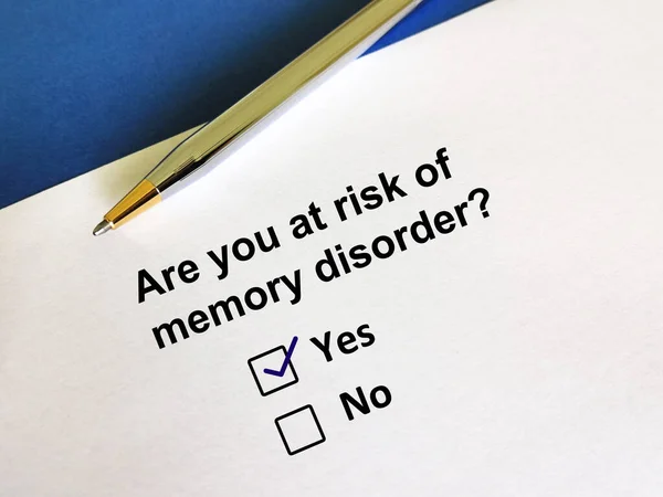 One person is answering question. The person is answering question about risk of memory disorder.