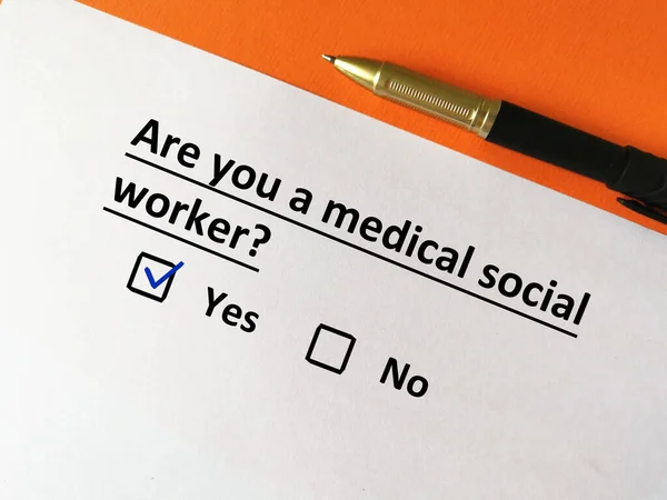 stock image One person is answering question about medical specialist. He is a medical social worker.