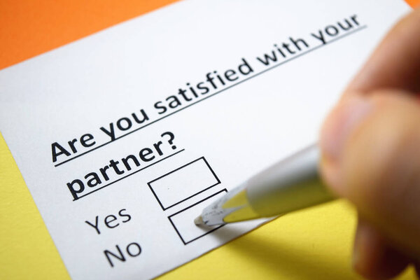 A person is answering question about satisfaction with partner.