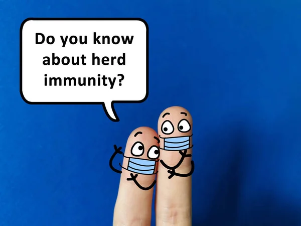 Two fingers are decorated as two person wearing mask during pandemic. One of them is asking about herd immunity