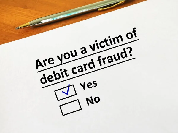 One person is answering question. The person is a victim of  debit card fraud.