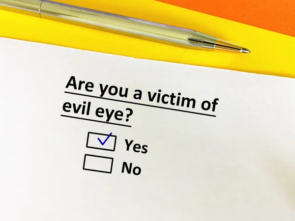 One person is answering question. The person is a victim of  evil eye.