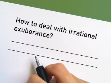 One person is answering question about banking. He is thinking how to deal with irrational exuberance.