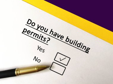 One person is answering question. He has building permits. clipart