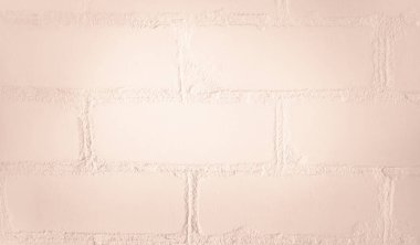 Pürüzsüz alçıyla kaplı açık bej tuğla bir duvara yakın plan. İç tasarım, mimari veya modern dekoratif için mükemmel, yumuşak dokusu ve sıcak tonu olan minimalist pastel arkaplan