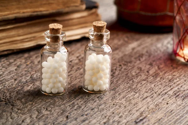 Bottles with homeopathic remedies on a table