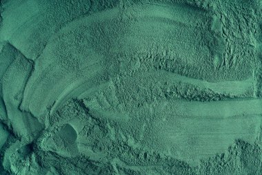 Sarmaşık alg tozundan yapılmış yeşil arkaplan, üst görünüm