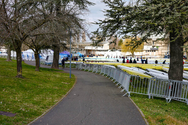 Rowing athletes preparing boats and equipment for a regatta on the Saone River in Macon France on January