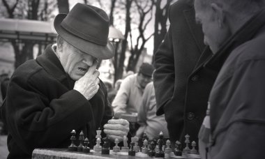 Kiev, Ukraine - Sep 5: Old men playing chess in the park , on Sep 5, 2010 in Kiev, Ukraine. clipart