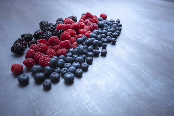 berries mix on an abstract gray background.