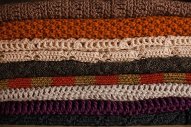 Knitted things. Tangles, knitting needles, and a hook. Background and place for the text.