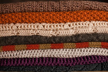 Knitted things. Tangles, knitting needles, and a hook. Background and place for the text.