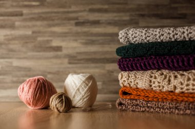 Knitted things. Tangles, knitting needles, and a hook. Background and place for the text.