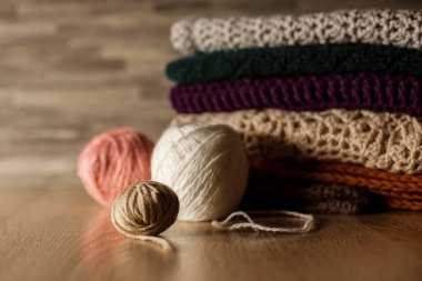 Knitted things. Tangles, knitting needles, and a hook. Background and place for the text.