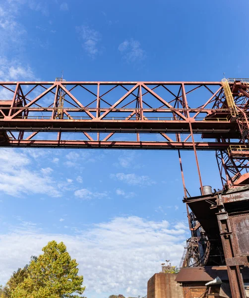 Large panorama of overhead trolley system on the exterior of a steel manufacturing facility, Rivers of Steel, vertical aspect