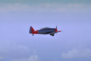 İkinci Dünya Savaşı stili pervaneli tek motorlu uçak, bulutlarla gökyüzünde uçuyor, hareket bulanıklığı olan pervane.