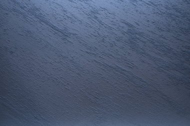 Beton bir levhanın pürüzlü yüzeyi, yüksek büyütmede. Arkaplan, doku