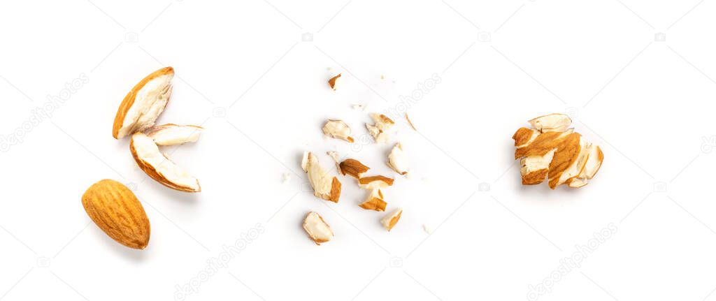 Crushed almonds isolated on white background closeup. Sliced scattered almond seeds and cut kernels collection