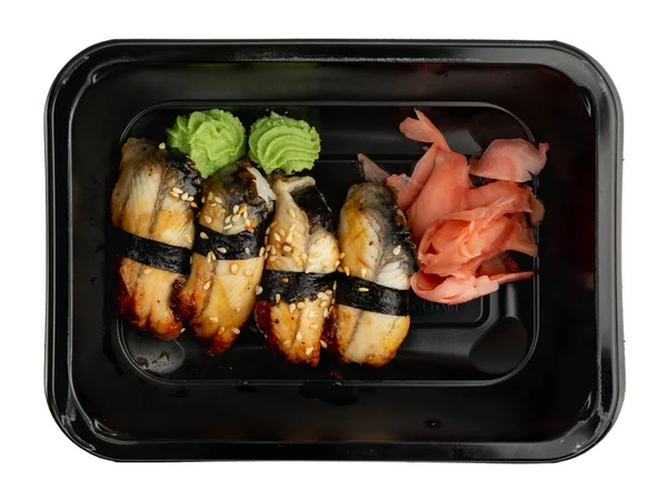 うなぎ握り寿司付きのプラスチック製容器はテイクアウト用に用意されています うなぎ寿司の孤立したトップビューで弁当箱を奪う — ストック写真