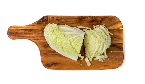 Sliced Chinese Cabbage, Napa Cabbage or Wombok on Wooden Cutting Board Isolated Top View. Fresh Green Cabbage — Stock Image Sliced Chinese Cabbage Napa Cabbage Wombok Wooden Cutting Board Isolated Royalty Free Stock Images