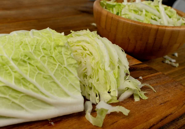 Macro Photo of Cut Chinese Cabbage, Napa Cabbage or Wombok on Wooden Rustic Background. Fresh Green Cabbage Closeup — Stock Image Macro Photo Cut Chinese Cabbage Napa Cabbage Wombok Wooden Rustic Royalty Free Stock Photos