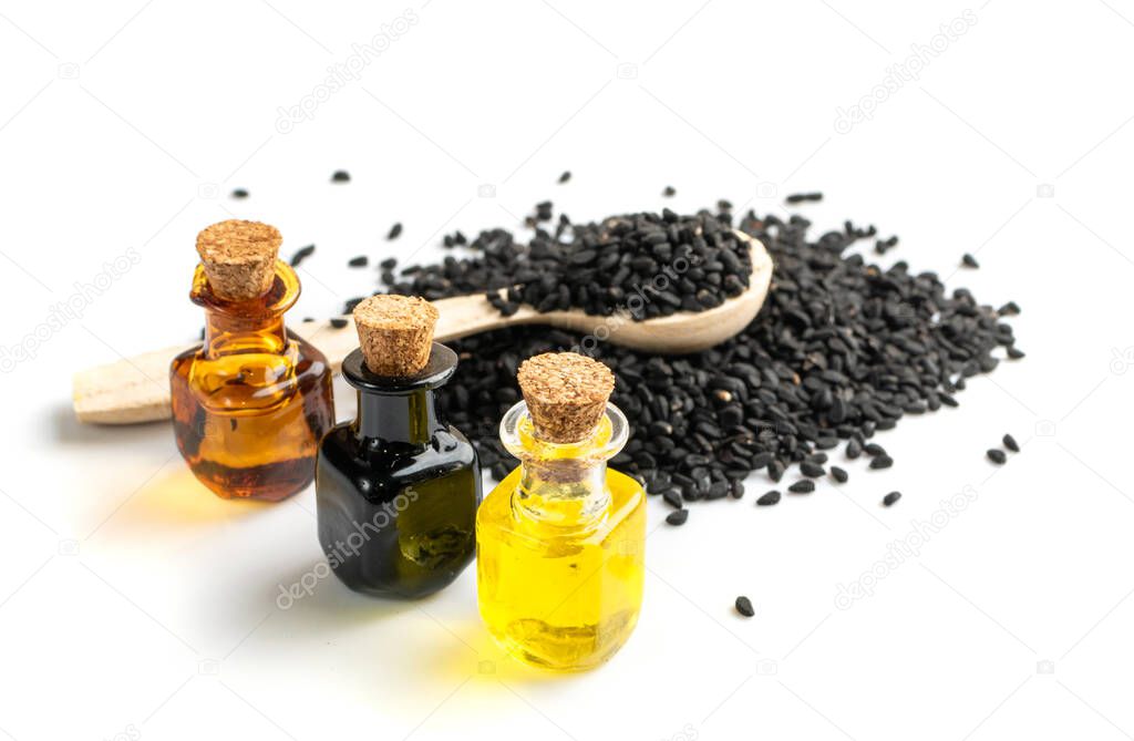 Black cumin oil in small vintage bottle isolated. Caraway seeds organic essential oil, tincture, extract, infusion. Nigella sativa also known as nigella, kalojeere and kalonji tincture, essence