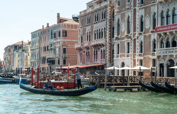 Italy, Venice July 23, 2020: Editorial Image of Famous Italian Venice in Summer with Ancient Venetian Houses over the Grand Canal, Gondolas and Gondoliers