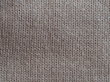 Yumuşak, dokulu desenli örülmüş kumaş yakın çekim. Tarafsız tonlar sıcak, samimi bir his verir. Tekstil, moda veya iç tasarım projeleri için ideal. Çok basit. Doku nazik, davetkar ve dokunaklı hissettiriyor.