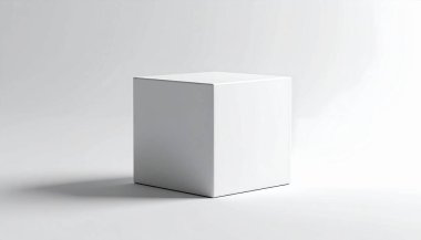 Gösterişli, beyaz minimalist bir küp gri arka planda yumuşak gölgeler bırakıyor, basitliği ve temiz tasarımı vurguluyor.