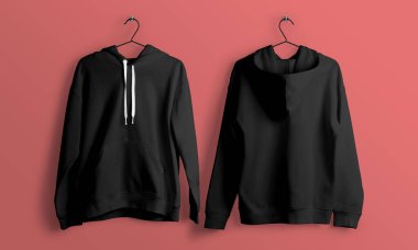 Pembe bir duvara asılı iki siyah kapüşonlu kazak. Basit, minimum ürün fotoğrafçılığı yumuşak gölgeler ve temiz bir stüdyo..