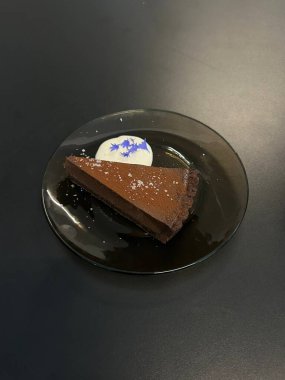 Rich and velvety chocolate cheesecake slice with a smooth, creamy texture and deep cocoa flavor. A perfect balance of indulgence and sweetness for a decadent dessert experience.