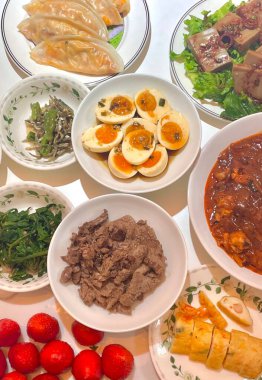 Warm and comforting jibbap (home-cooked Korean meal) with a spread of rice, soup, and banchan, offering a perfect harmony of flavor, tradition, and heartwarming nourishment in every bite.
